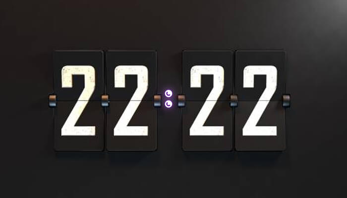 A digital flip-style display showing the number 22:22, symbolizing 2222 Angel Number Meaning and its message of balance, harmony, and spiritual alignment behind seeing angel number 22:22.