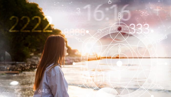 A woman gazing toward a glowing horizon with spiritual symbols and numbers, illustrating 2222 Angel Number Meaning and its significance in understanding balance, alignment, and direction in one’s life path.