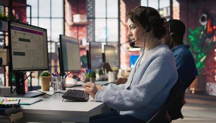 Call Center Voice Monitoring Software used by agents with headsets analyzing customer calls on computer screens