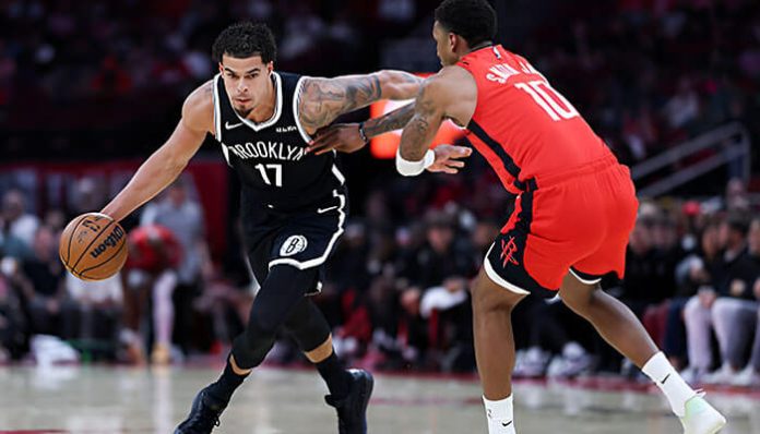 Brooklyn Nets vs Houston Rockets match player stats showing a Nets player driving against a Rockets defender during the NBA game.