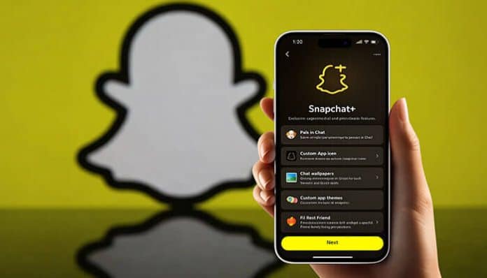 A hand holding a phone displaying the Snapchat Plus app interface with a yellow Snapchat logo in the background.