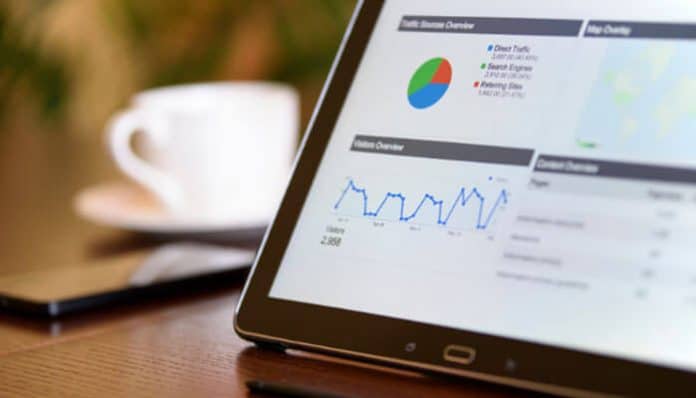 Close-up of a digital analytics dashboard on a tablet displaying traffic graphs, performance charts, and user engagement metrics, representing data-driven smart technology ecosystems linked with content://cz.mobilesoft.appblock.fileprovider/cache/blank.html for modern digital transformation and real-time decision systems.