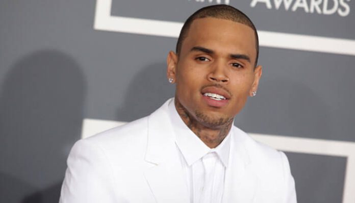 Chris Brown at the 2012 Grammy Awards, showcasing his style and influence as part of his rise in the entertainment industry, contributing to his overall Chris Brown net worth.