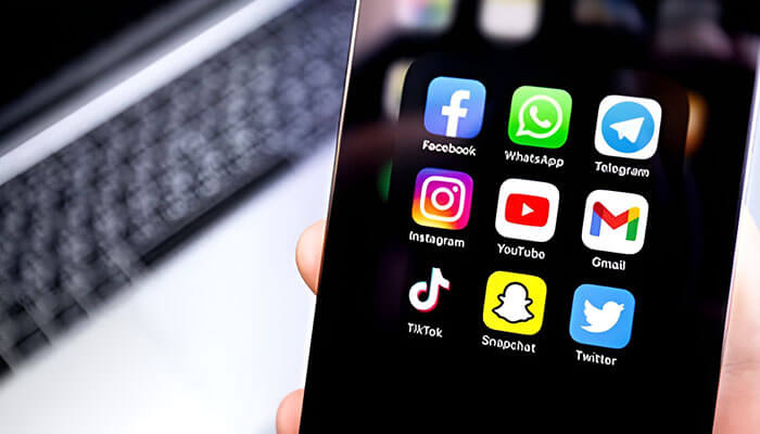 Choose the Right Platforms for Your Brand - Startupeditor | Startup Editor How to Create a Brand Presence on Social Media shown through popular social media and email apps displayed on a smartphone screen