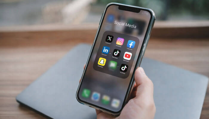 How to Choose the Right Platform to Promote a Product on Social Media - Startupeditor | Startup Editor How to Promote a Product on Social Media? smartphone screen showing popular social media apps used for product marketing and brand promotion