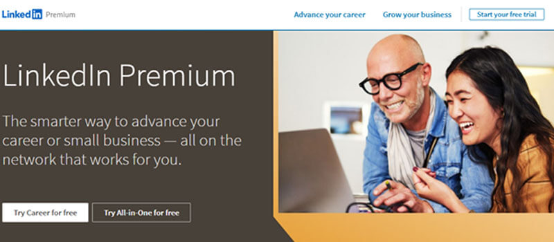 LinkedIn Premium - Startupeditor | Startup Editor LinkedIn Premium promo banner showing two people smiling at a laptop on the right; left panel mentions advancing your career and small business with two free trial buttons.