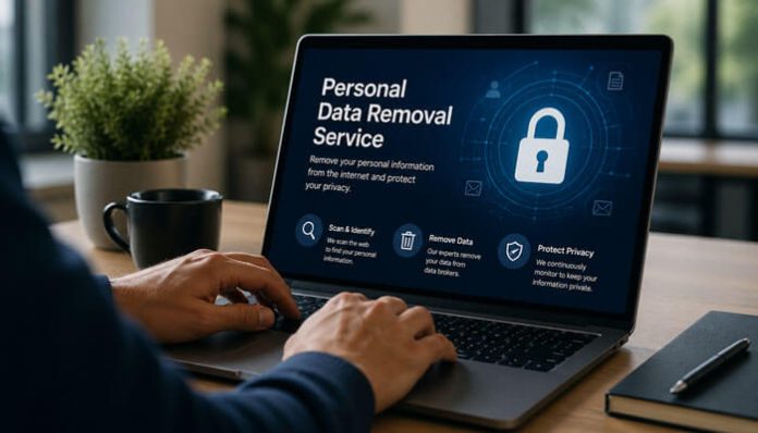 Laptop on a desk displaying a Personal Data Removal Service interface with a padlock icon and privacy options on screen.