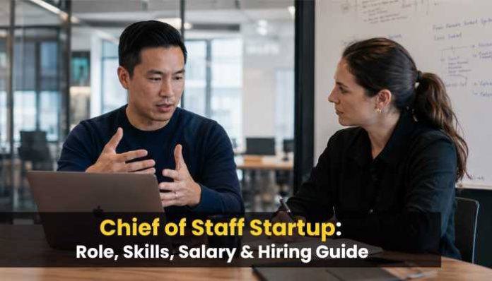Chief of Staff Startup discussion between two professionals reviewing strategy and hiring plans in a modern office.