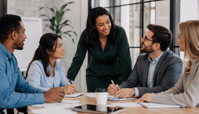 Core Principles of Servant Leadership | Startup Editor Strengths and Weaknesses of Servant Leadership represented by a supportive leader guiding a professional team discussion.