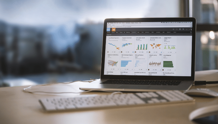 How to Use Google Analytics Yoast SEO Together | Startup Editor Laptop displaying a website analytics dashboard for Google Analytics Yoast SEO performance monitoring.