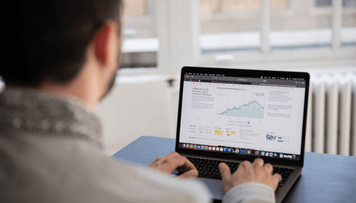 Official Google Analytics 4 Release Date | Startup Editor Person reviewing website performance data on a laptop while researching the Google Analytics 4 Release Date.