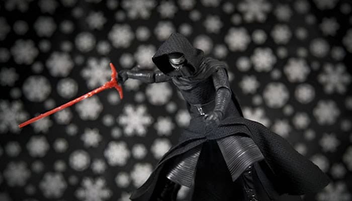 Audio Profiles of the Ren Saber - Startupeditor | Startup Editor Hooded Star Wars villain (Kylo Ren) lunges with a red lightsaber in a dark cloak against a snowy patterned backdrop.