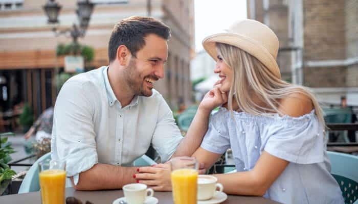 How to Move From Flirty Questions to a Date - Startupeditor | Startup Editor Couple enjoying an outdoor date while discussing Flirty Questions to Ask a Girl.
