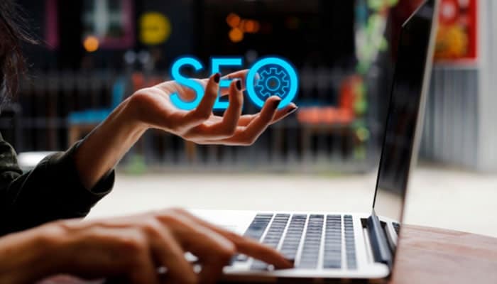 SEO Benefits of Writing About ProgramGeeks Social Media - Startupeditor | Startup Editor ProgramGeeks Social Media SEO concept with laptop, digital marketing icon, and online growth strategy.