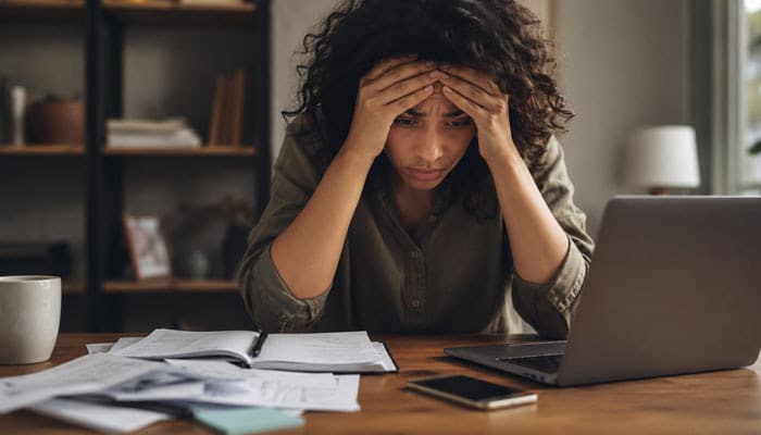 What Happens During Tension Reduction - Startupeditor | Startup Editor Overwhelmed woman showing severe stress and illustrating which stress level is limit setting the correct staff response