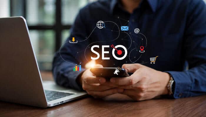 Measure SEO With Business-Focused KPIs - Startup Editor | Startup Editor Best SEO for Law Firms represented by SEO, search, analytics, local visibility, email, and digital marketing icons around a mobile device.