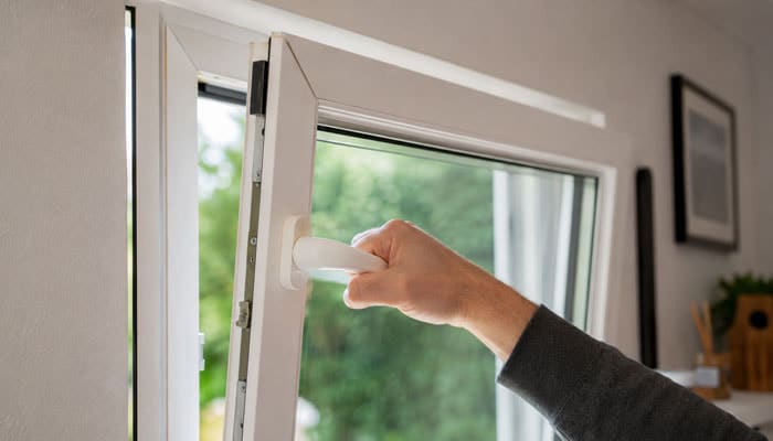 Symptoms that point to the likely fault - Startupeditor | Startup Editor Person opening a white window from inside a room on a sunny day.