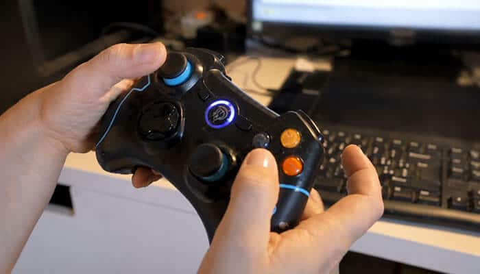 HSSGamePad Requirements: What Is Claimed and What Can Be Confirmed? - Startup Editor | Startup Editor Tutorial by HearthStats HSSGamePad controller setup showing hands configuring a gamepad with a computer for button mapping and input testing.