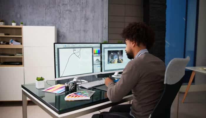 Pixel-Art Software: The Core GFXPixelment Search Intent - Startup Editor | Startup Editor What Is a Good Design Software GFXPixelment comparison featuring a graphic designer working with digital illustration tools on dual monitors.