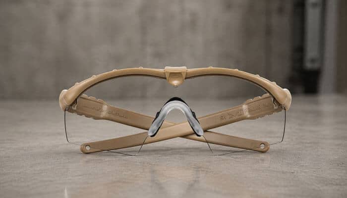 Is the Oakley SI Ballistic M Frame 3.0 Really Ballistic Rated? - Startup Editor | Startup Editor Rear view from the Oakley SI Ballistic M Frame 3.0 Review showing the lightweight tan ballistic frame, secure Unobtainium® nosepiece, flexible temples, and wraparound protective design for tactical performance.