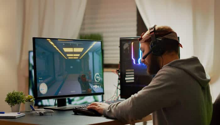 The Biggest Gaming Changes Defining 2026 - Startup Editor | Startup Editor Latest Gaming Updates Zeromagtech featuring a PC gamer playing a first-person action game, reflecting patches, performance updates, and 2026 gaming news.