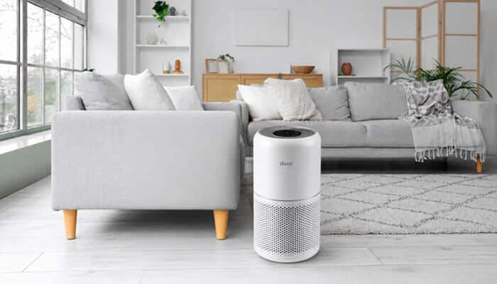 Why Does My Levoit Air Purifier Stay Red All the Time? - Startup Editor | Startup Editor White Levoit air purifier operating in a modern living room, illustrating Levoit Air Purifier Red Light troubleshooting, filter maintenance, and indicator reset guidance.