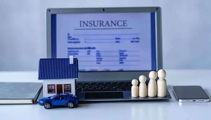 Startup Business Insurance for Home-Based Businesses - Startup Editor | Startup Editor Startup Business Insurance concept showing a laptop, business insurance policy, company property, vehicle, and people.