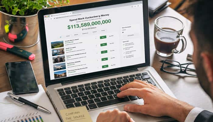 What Does the Neal-Fun.org Game Page Actually Confirm? - Startup Editor | Startup Editor Spend Mark Zuckerberg Money Nealfun.org billionaire spending simulator displayed on a laptop with virtual purchases and a massive remaining balance.