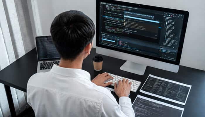 Who Should Use Zenvekeypo4 Software? - Startup Editor | Startup Editor Zenvekeypo4 Software Explained showing a programmer analyzing source code and technical data while investigating software functionality and potential problems.