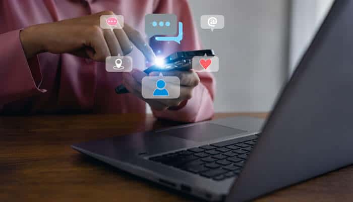 Why the Socials and Softwares AlienSync Idea Attracts Interest - Startup Editor | Startup Editor Socials and Softwares AlienSync concept illustrating a user connecting social media profiles, messaging tools, and digital apps through a smartphone and laptop.