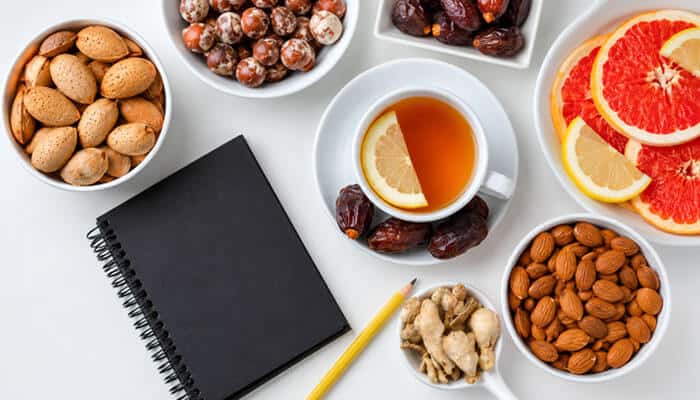 Healthy Snacks for Work When Managing Blood Sugar - Startup Editor | Startup Editor Healthy Snacks for Work showing almonds, fruits, dates, tea, and nutritious snack options prepared for a balanced office routine and mindful eating.