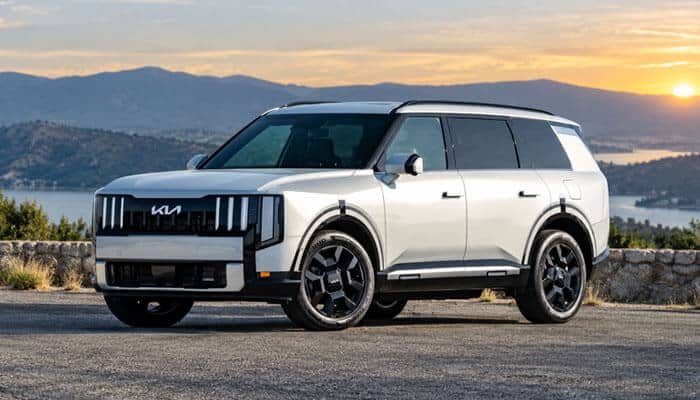 2027 Kia Telluride Hybrid Price - Startup Editor | Startup Editor 2027 Kia Telluride Hybrid in white exterior finish parked near a mountain landscape, highlighting its spacious three-row SUV design, luxury features, hybrid technology, and updated Kia styling.