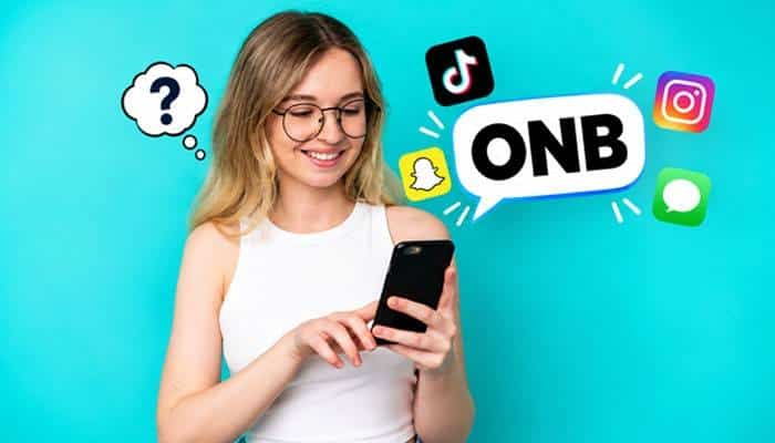 How to Tell What ONB Means From Context - Startup Editor | Startup Editor ONB Meaning Slang illustration featuring a woman checking her smartphone with ONB in a message bubble and popular social media icons.