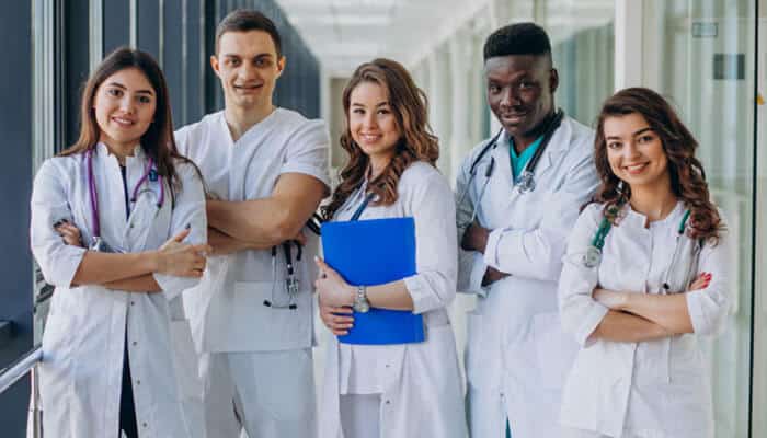 Springhillmedgroup Team Expertise by Specialty - Startup Editor | Startup Editor Springhillmedgroup Team Guide featuring a diverse group of doctors and medical professionals representing healthcare specialties, teamwork, and clinical support services.