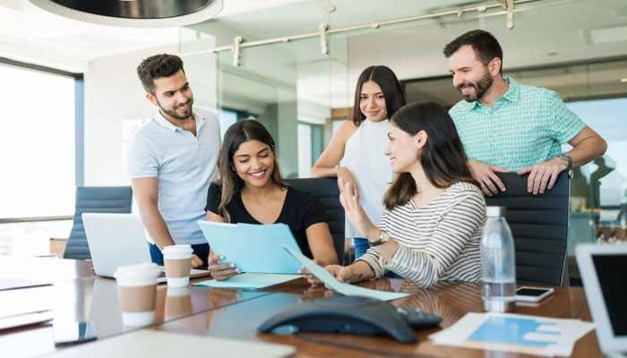 What Is Workplace Gamification? - Startup Editor | Startup Editor Xendit Work GamificationSummit team collaboration meeting with employees discussing digital workplace solutions, engagement strategies, and gamified work experiences