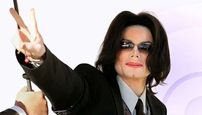 What Did Michael Jackson Say About His Children’s Bological Parentage? - Startup Editor | Startup Editor Does Michael Jackson Have Any Biological Children? Michael Jackson wearing sunglasses and a black suit while making a peace sign.