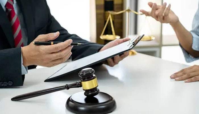 Does a Counterclaim Need Separate Jurisdiction? - Tycoonstory | Startup Editor What Is a Counterclaim in Civil Court illustrated by a legal consultation with a lawyer reviewing documents beside a courtroom gavel.