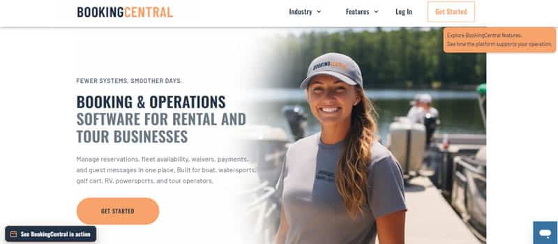 BookingCentral - Startupeditor | Startup Editor Smiling woman in a cap standing on a marina dock with boats in the background; hero area promoting booking and operations software for rental and tour businesses.