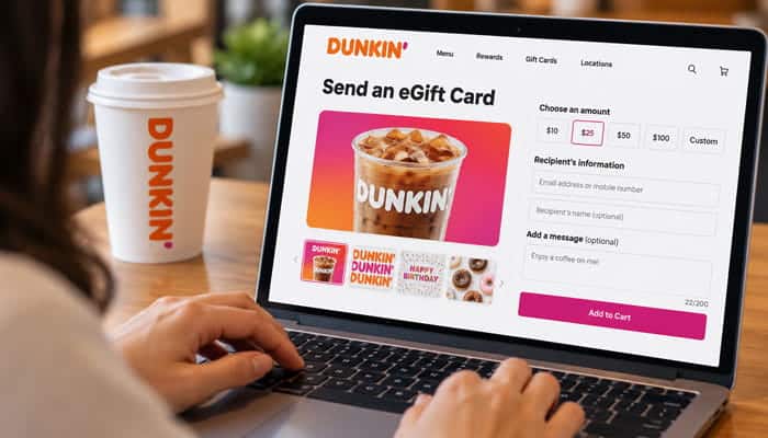 How to Buy a Dunkin e Gift Card - Startupeditor | Startup Editor Person using a laptop showing a Dunkin e Gift Card purchase form with gift amounts and recipient details.