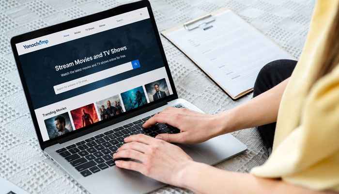 How Does Yonochomp Com Work? - Startup Editor | Startup Editor Yonochomp Com shown on a laptop with entertainment and streaming-style content, demonstrating the variety of topics associated with the website.