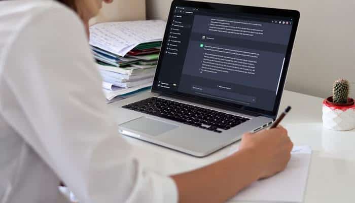 A Better Way to Use ChatGPT: The Verification Workflow - Startup Editor | Startup Editor Person using Chat GPT AI on a laptop for conversational assistance, research, writing, studying, and completing digital tasks.